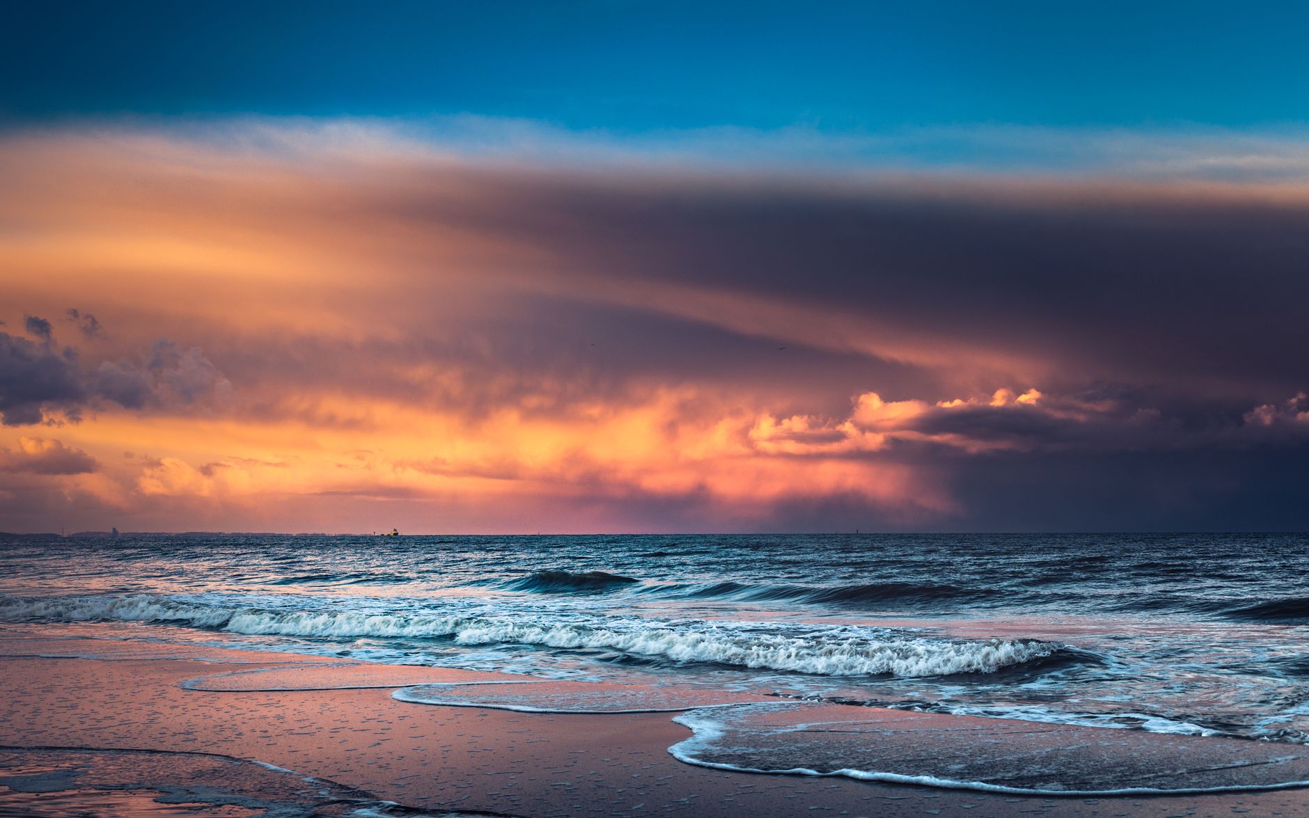 Vivid seascape at sunset captured at the serene shores of Gdańsk, Poland.