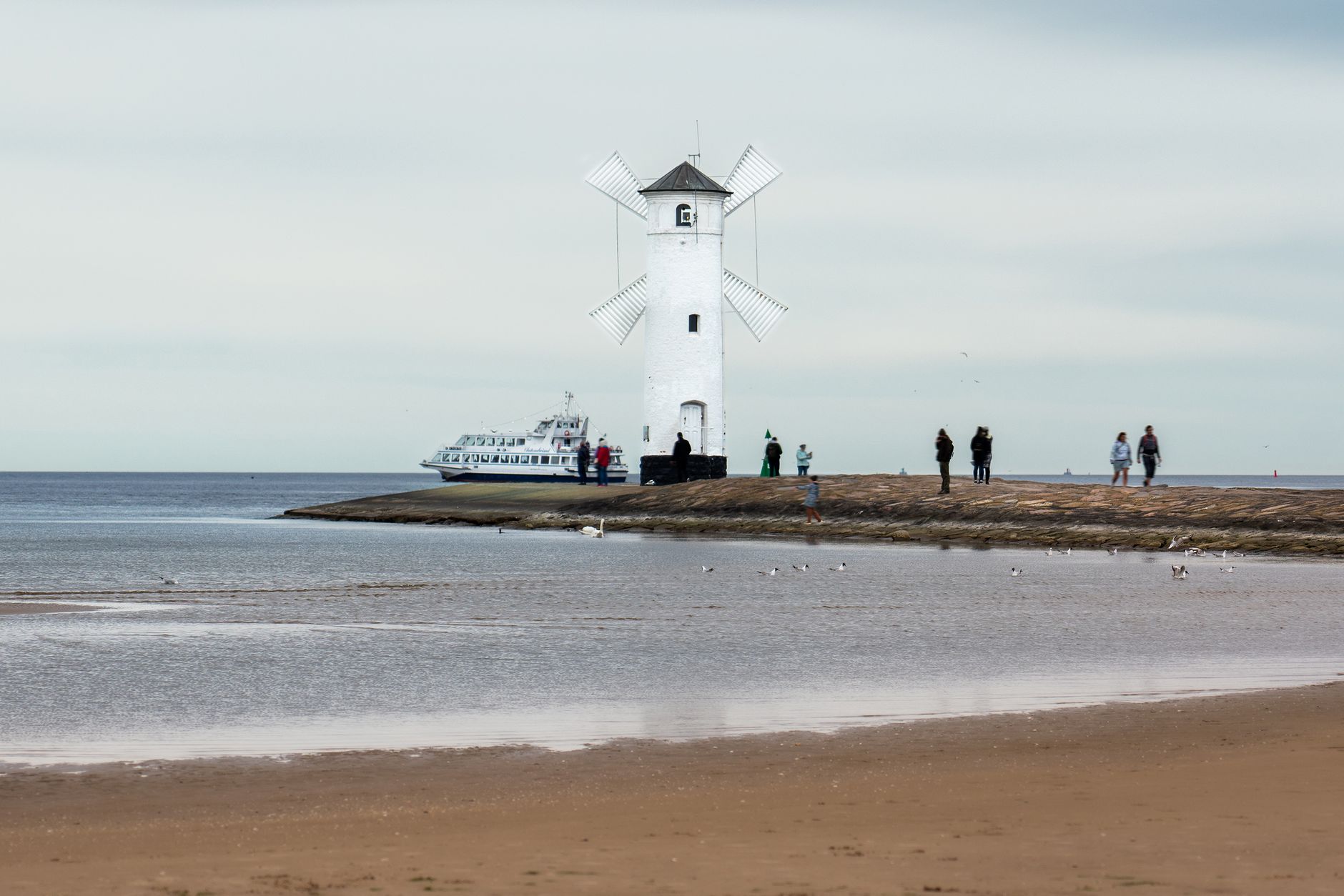 Stawa Młyny windmill on the Świnoujście beach, a popular Polish landmark.