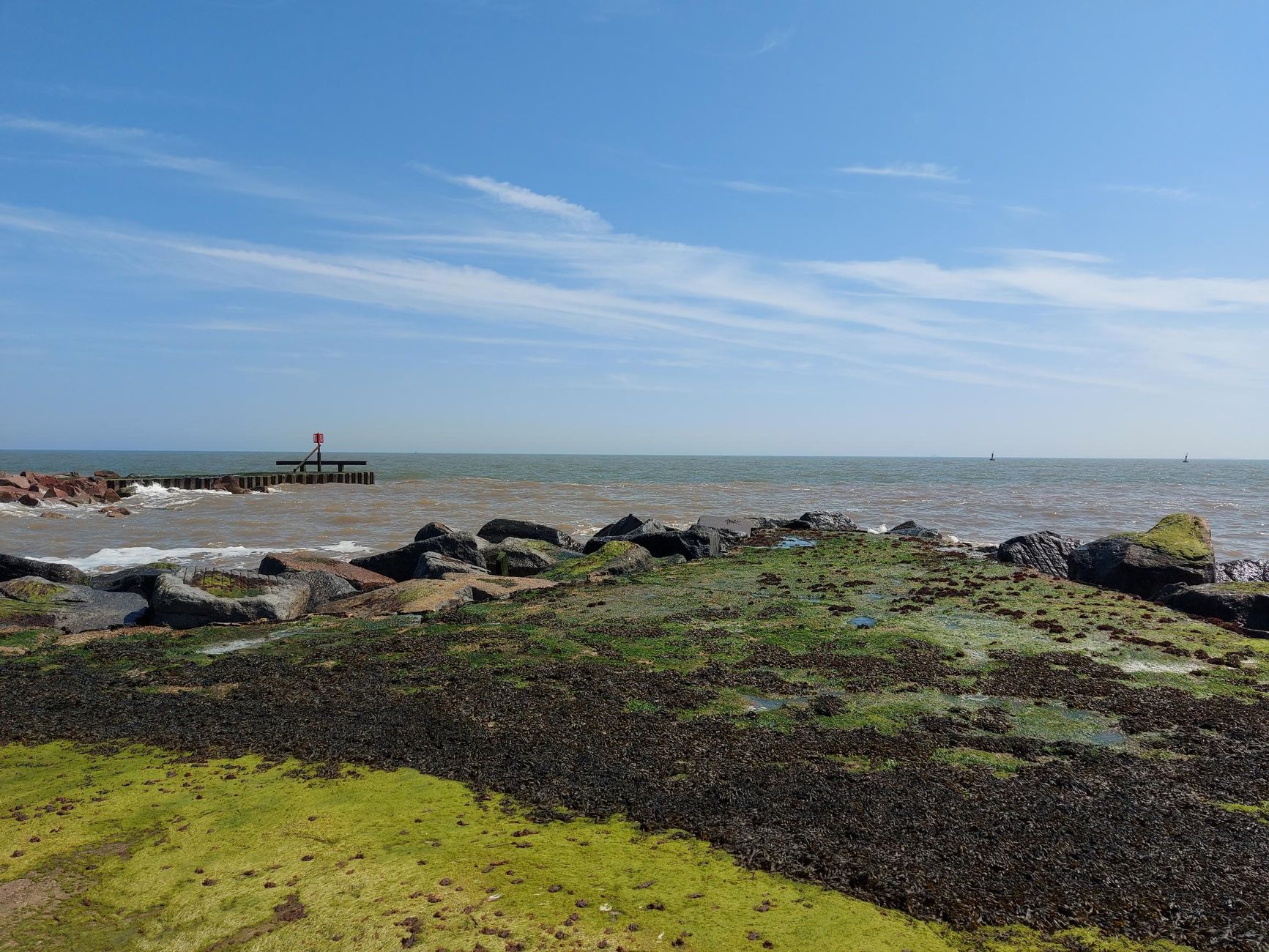 Scenic view of the rocky shoreline and breakwater at Lowestoft, England.