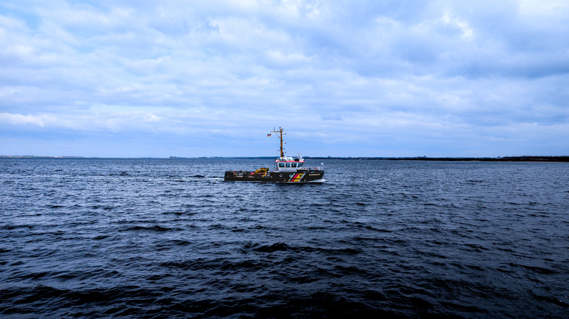 A patrol boat navigating the calm waters of the Baltic Sea near Wismar, Germany.