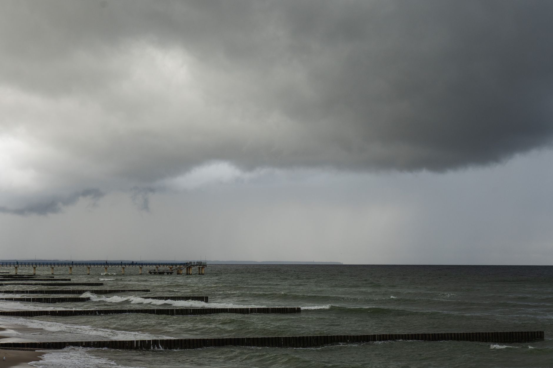Dramatic storm clouds over the Baltic Sea in Zelenogradsk, Russia. A moody coastal view.