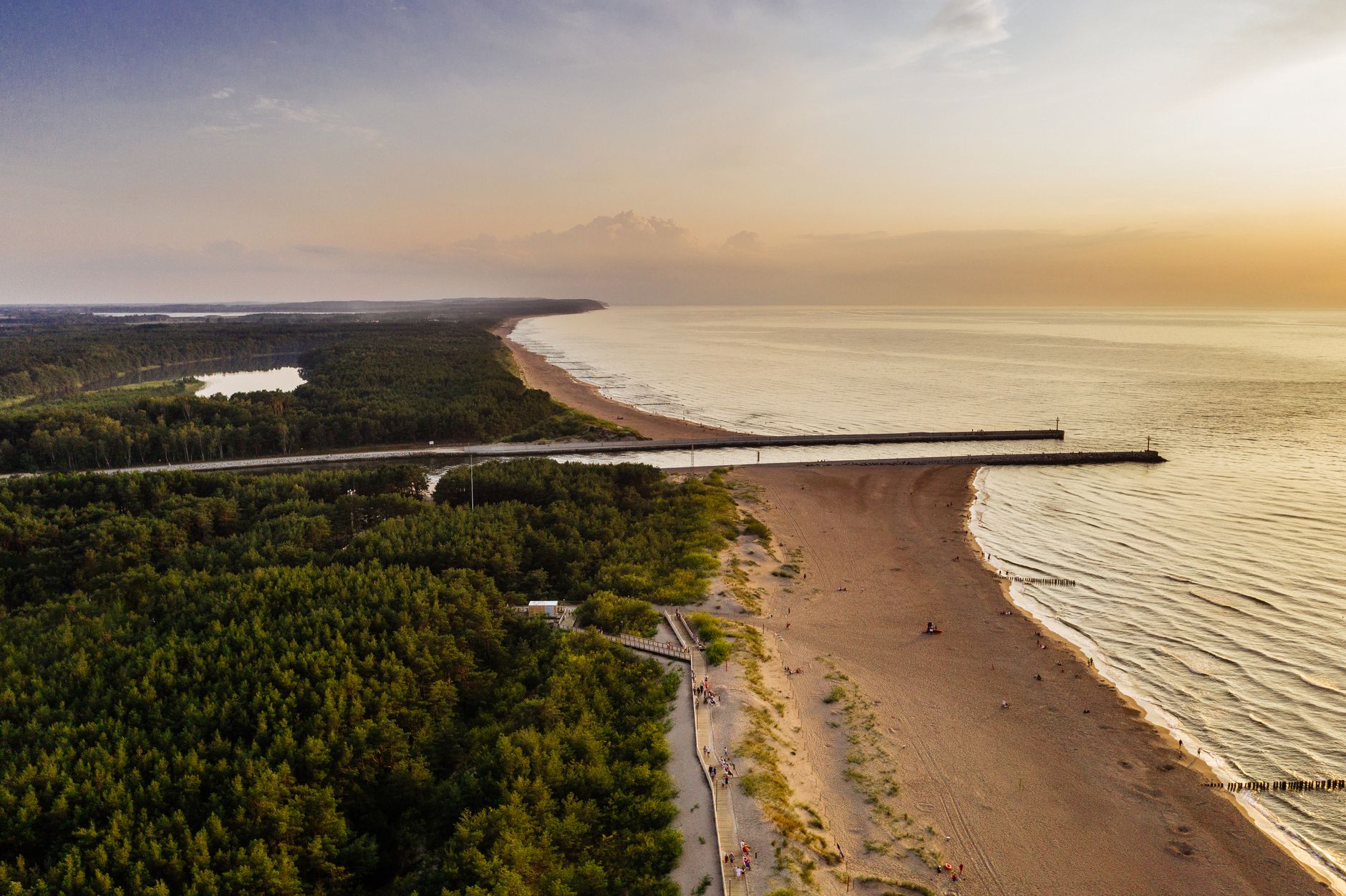 Scenic aerial view of Dziwnówek Beach in Poland during a beautiful sunset.
