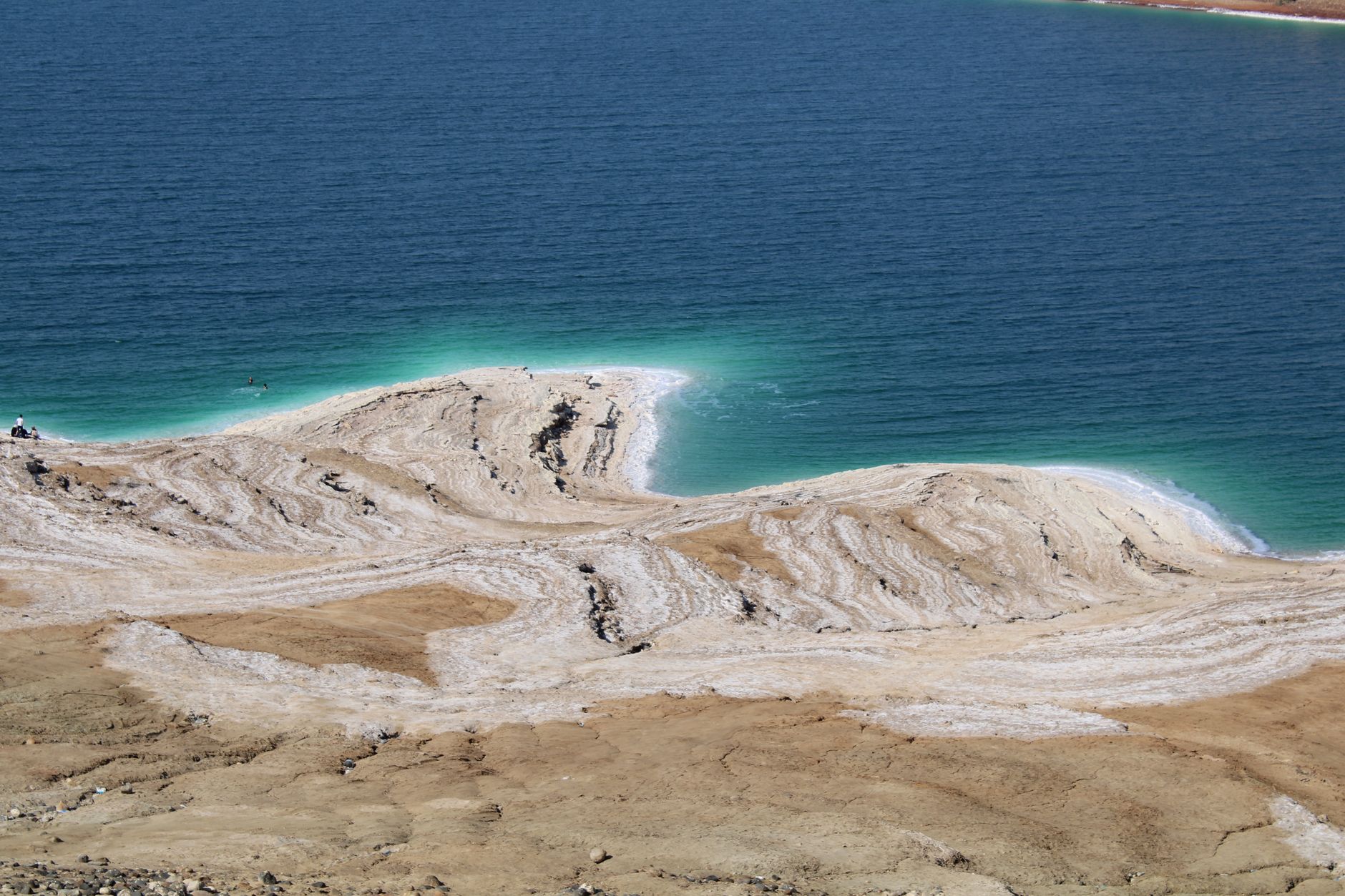 A striking aerial view of the Dead Sea's salt formations and blue waters.