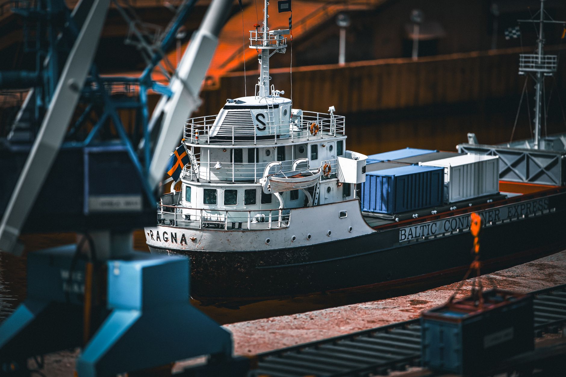 A cargo ship docked at a port loaded with containers, showcasing maritime transport.